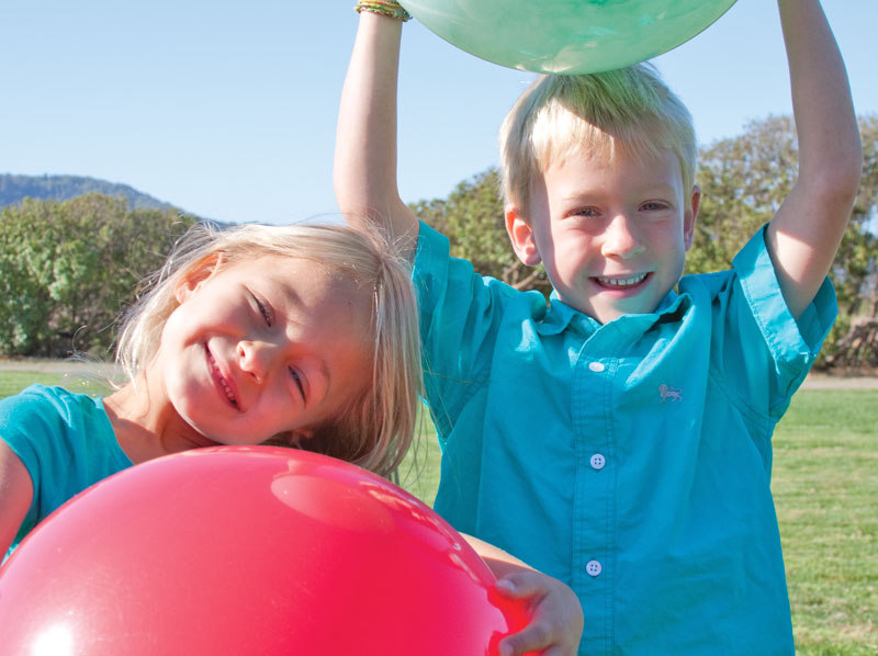 boy and girl playing with balls